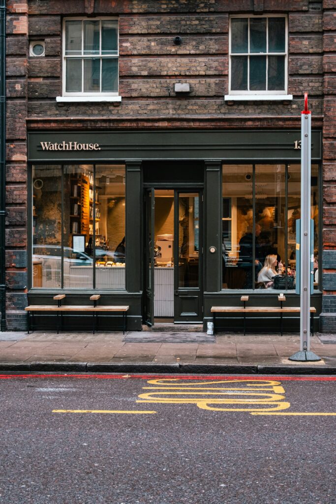 A storefront with a clock on a London high street, representing a local business that relies on Google Business Profile and local search to be found.