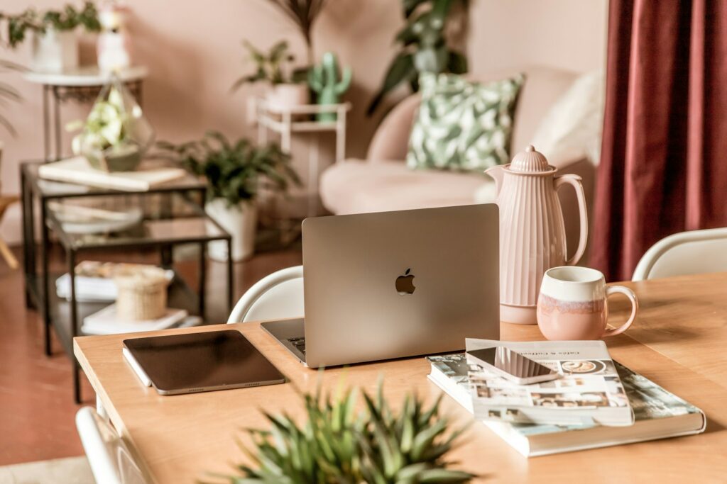 A laptop computer on a wooden desk, representing a UK-based digital agency workspace